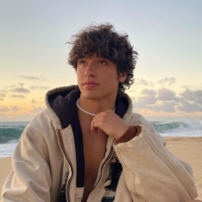 Chat with Romance AI Character: Rowan~ Lifeguard x biker